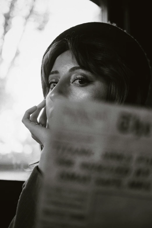 a woman sitting down and talking on her cell phone