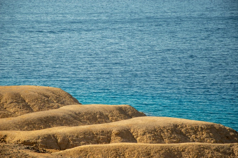 a group of rocks out on the ocean