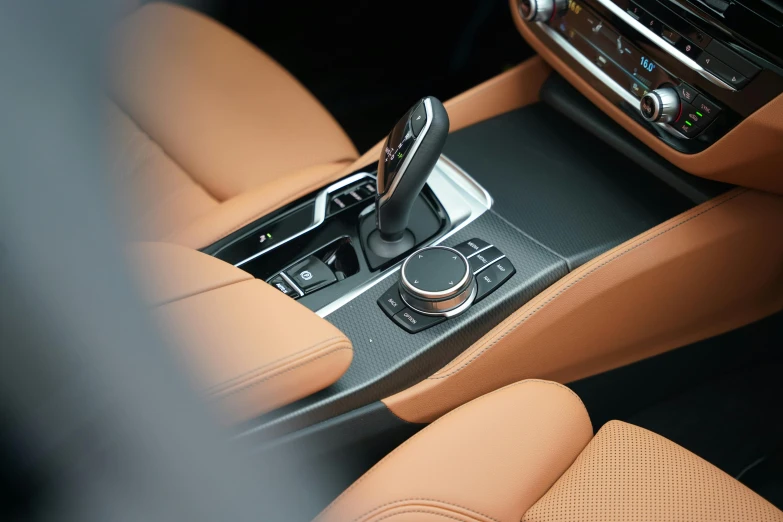 a car with a leather center console and dashboard