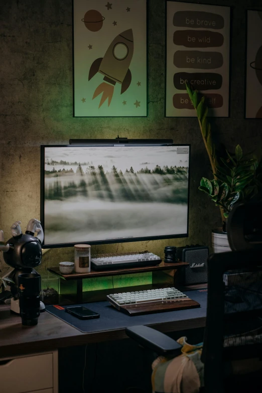 a desktop computer monitor on top of a wooden desk