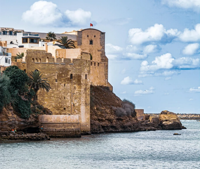 the castle on a cliff is located in the ocean