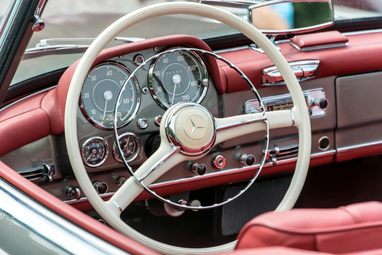 the interior of a classic car with a tan dashboard