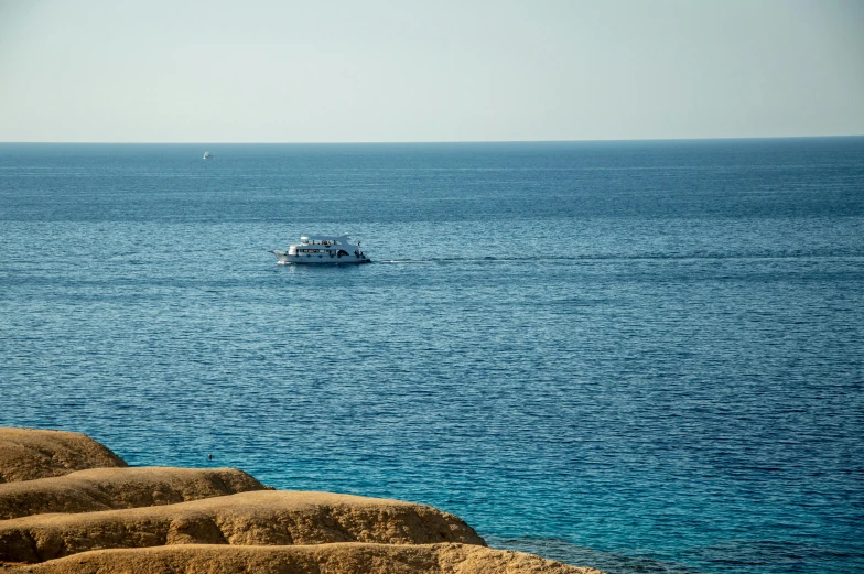 a boat that is out in the middle of some water