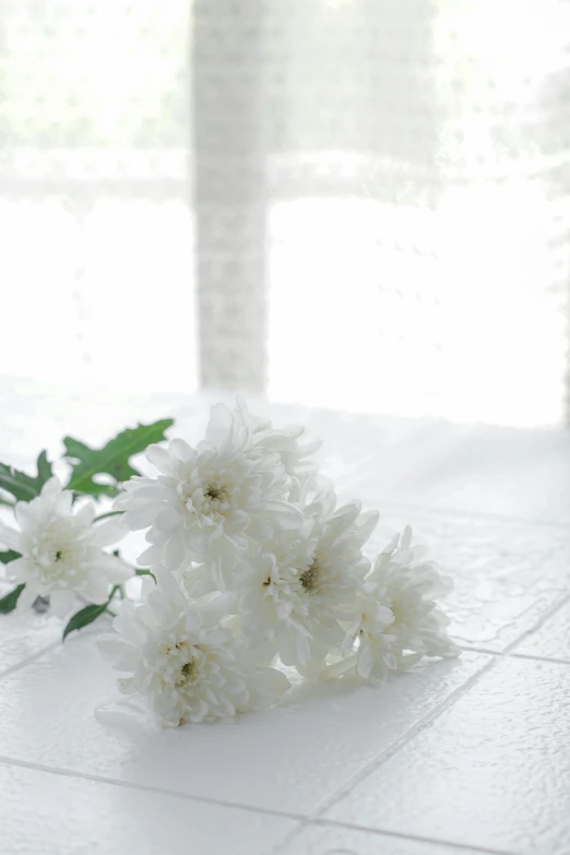 a bunch of flowers sitting on a table