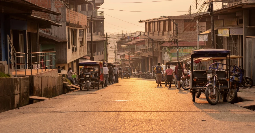 some people and motorcycles on a city street