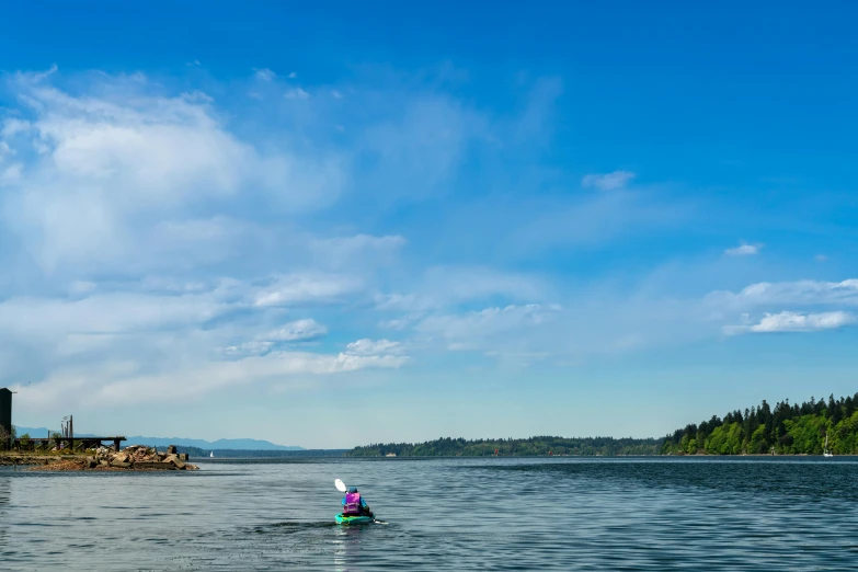 a small boat floating on top of a body of water