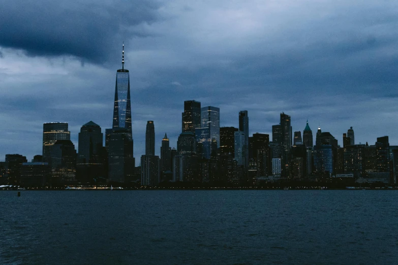 a large city with many tall buildings on a cloudy night