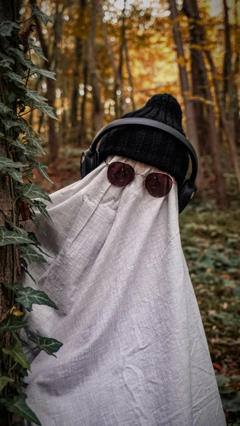 the head and shoulders of a person wrapped in a white fabric