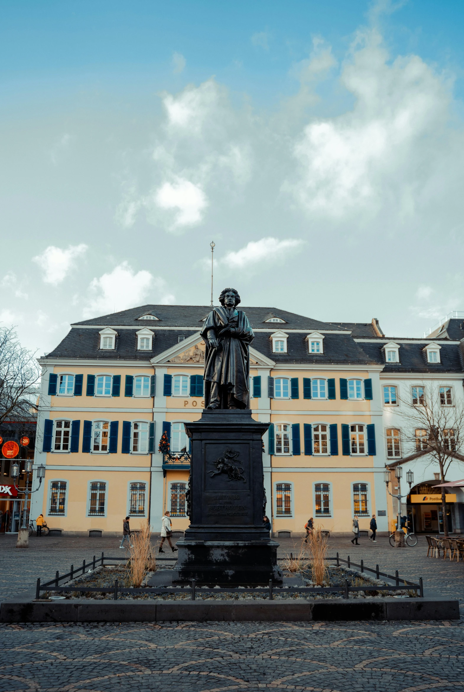 the statue is in front of the building