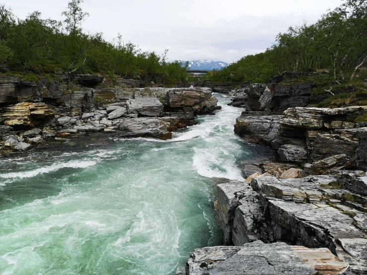 the rapids are green and blue with white waters