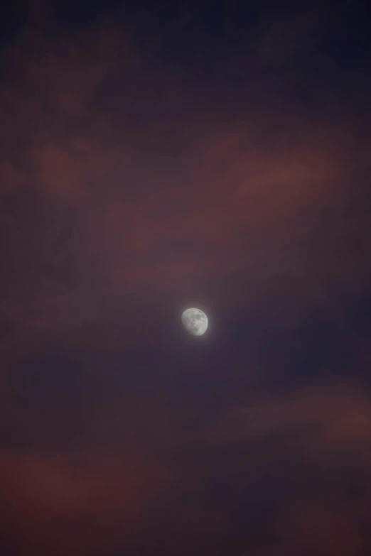 some type of cloud with an extremely bright moon