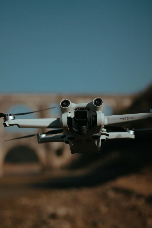 there is a small white aircraft with three propellers