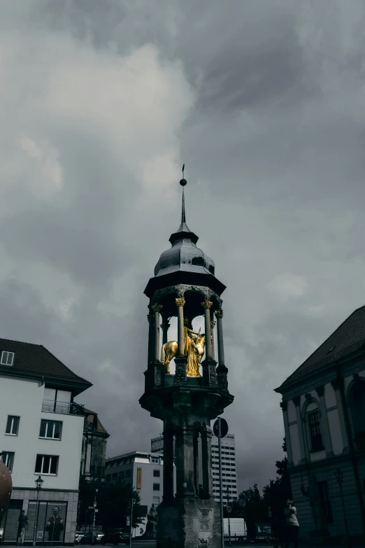 a view of a clock tower at the top of a building with clocks in it