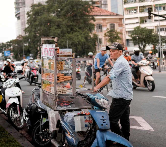 a street vendor on the street in front of a bike