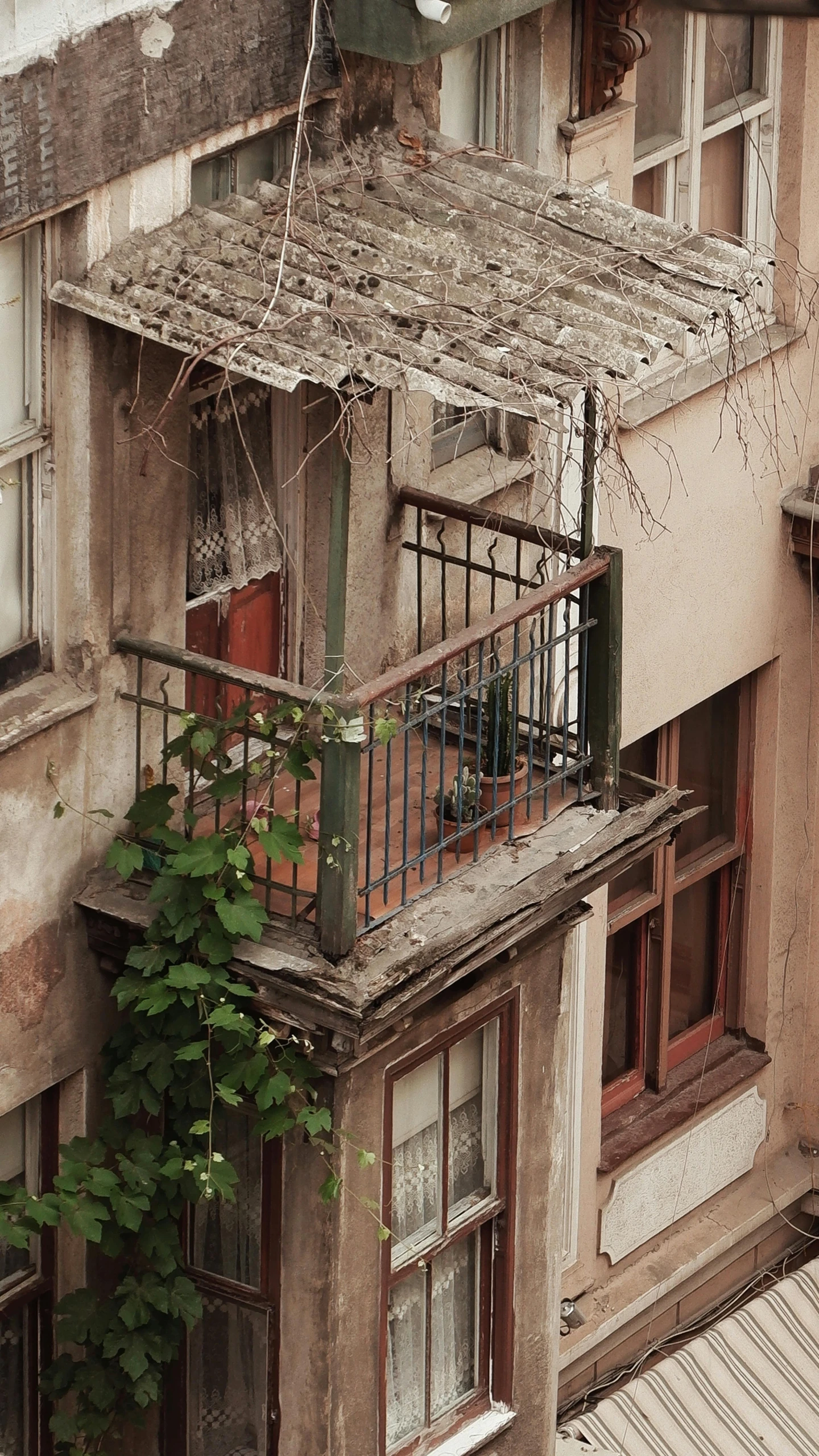 a building with lots of balconies on top