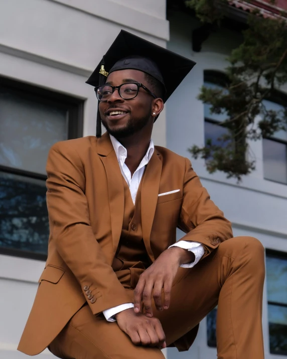 an image of a man in suit sitting on the edge of stairs