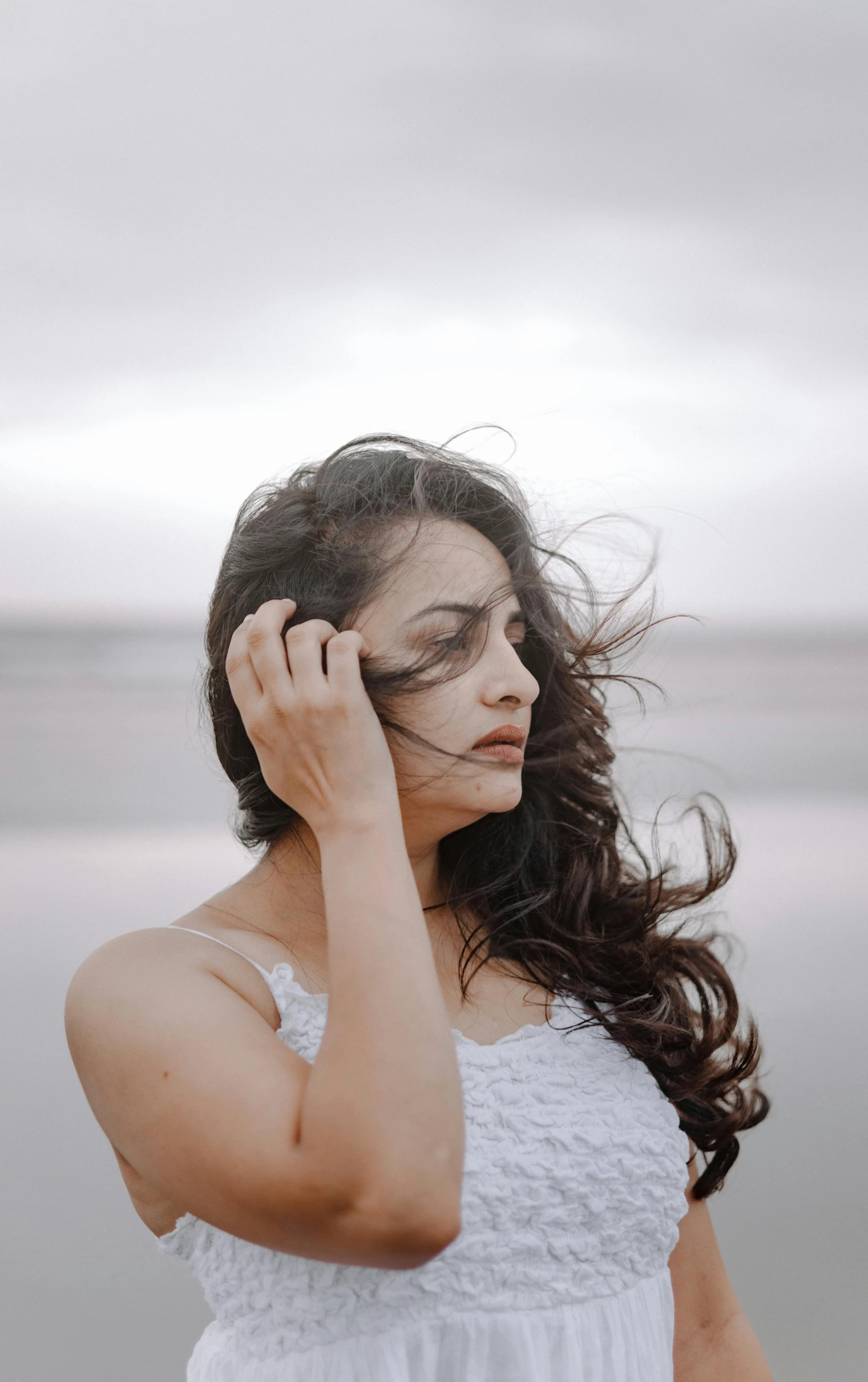 a woman with her head propped up on her hands