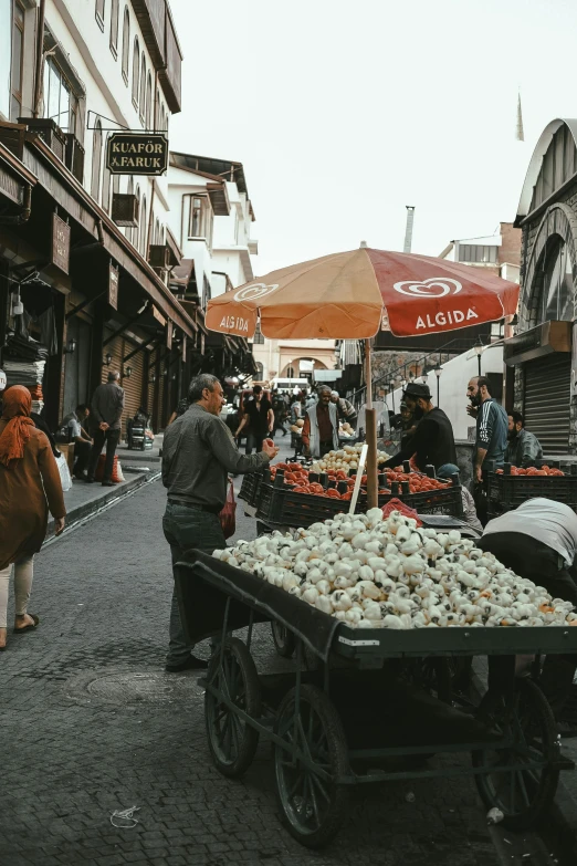 several people shopping at an outdoor market