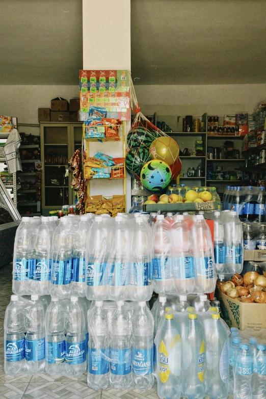 a display of bottled water at a store