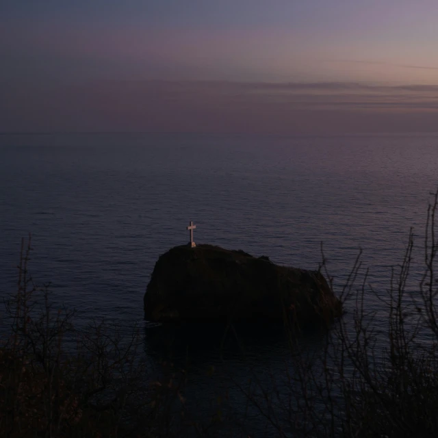 lone person standing on the edge of a cliff