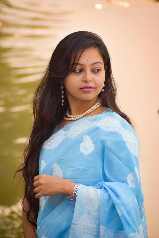 a girl dressed up with blue attire posing for the camera