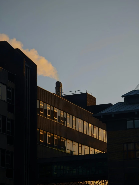 there is a large building with some windows at sunset