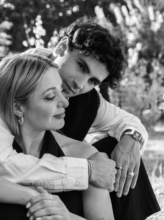 a couple is in love posing on a bench