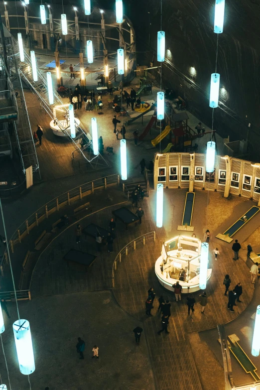 several people are walking around an empty mall