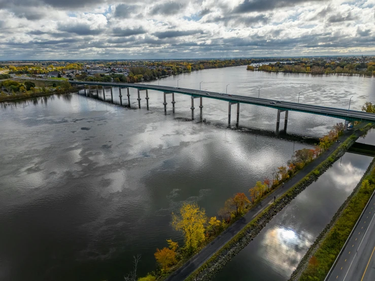 an aerial s of a river with some water and clouds