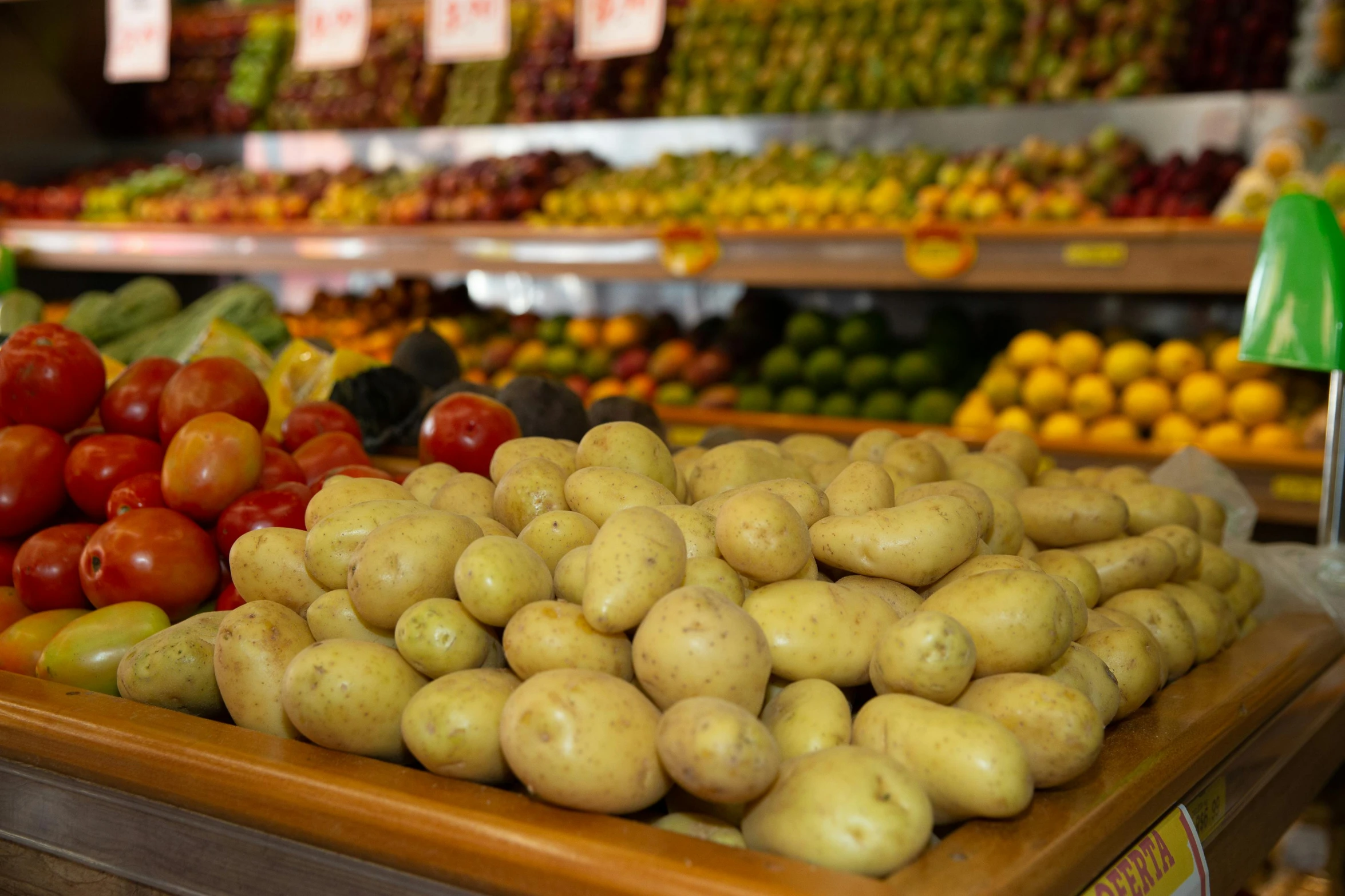 a bunch of potatoes sitting on a wood tray