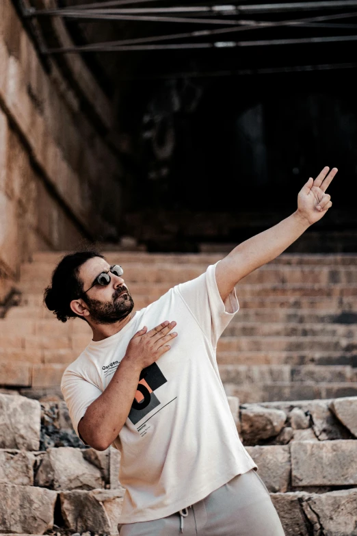 a man is standing in front of an open stone ampel