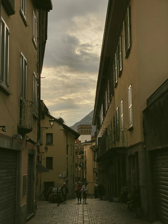 there is a woman walking down a street