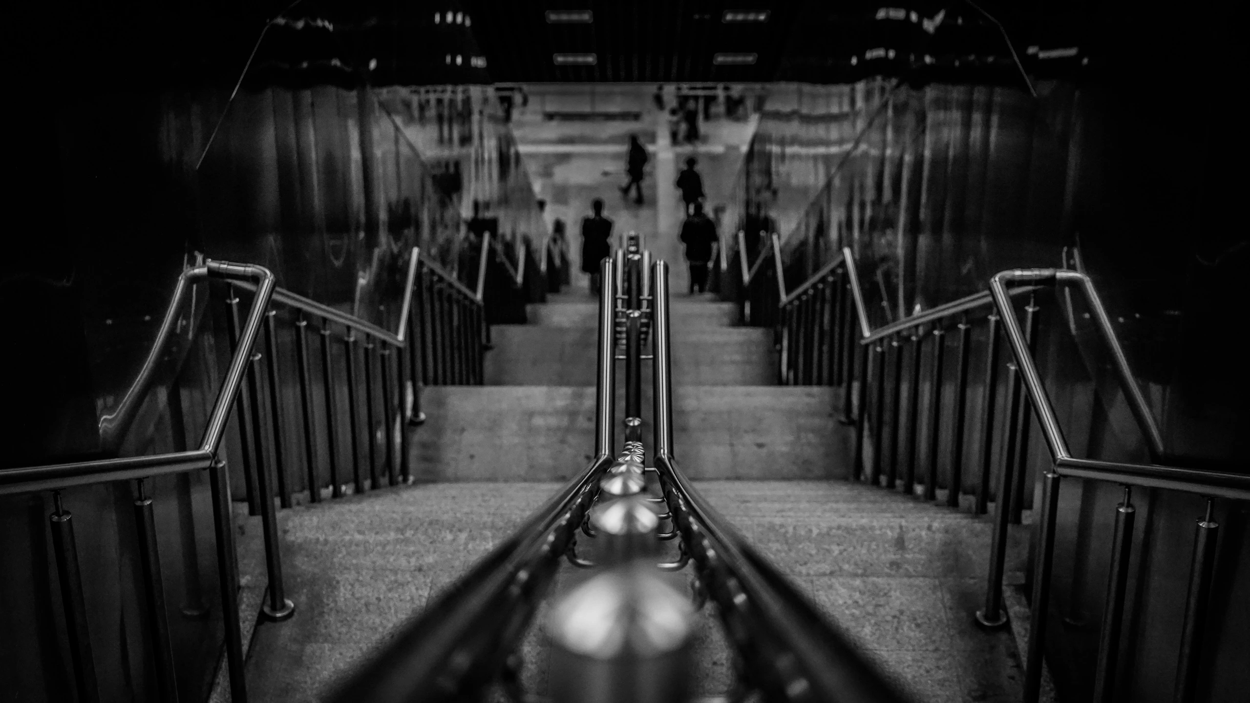 a person standing at the bottom of a stairway