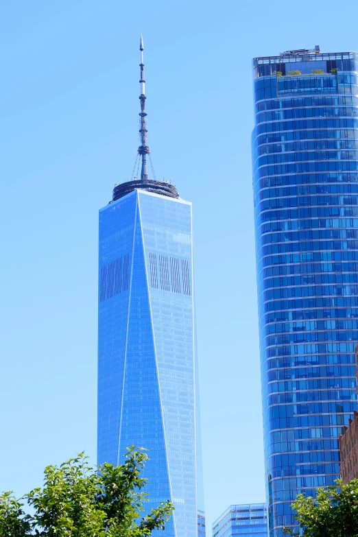 an office building with very high glass windows near the city