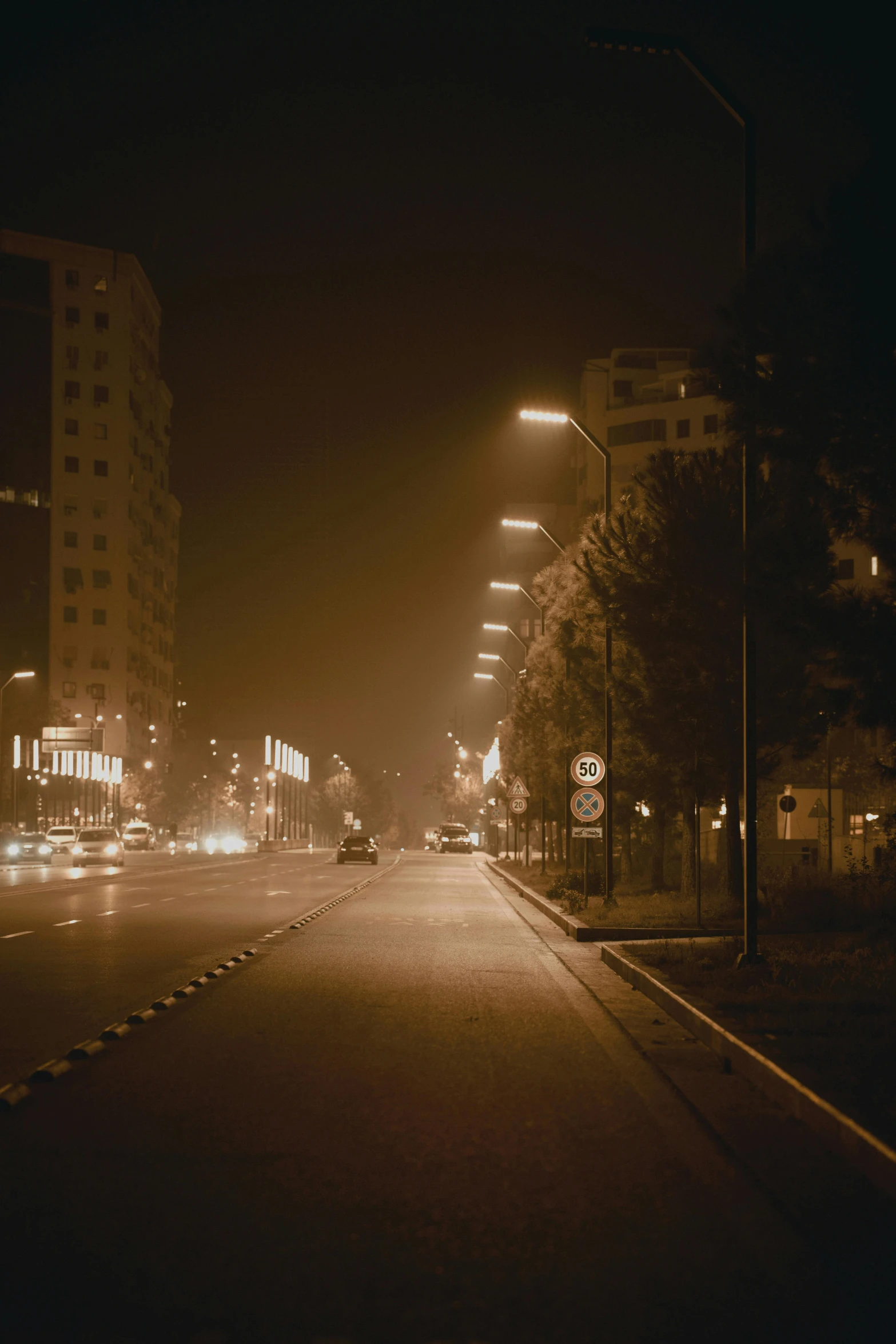 a street with buildings and lights on it