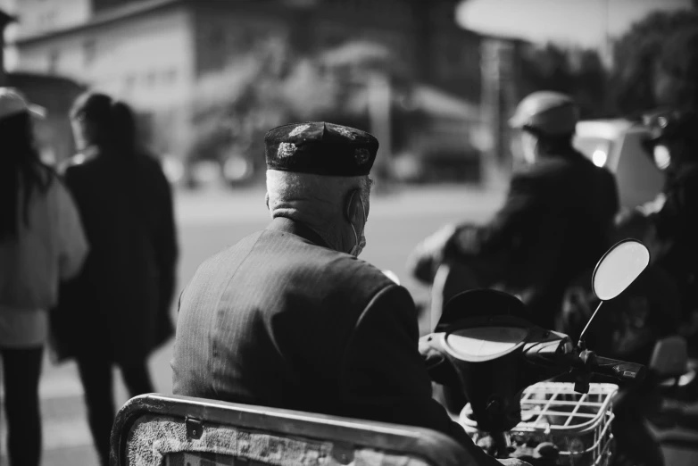 a man with his hat on is riding a motorcycle