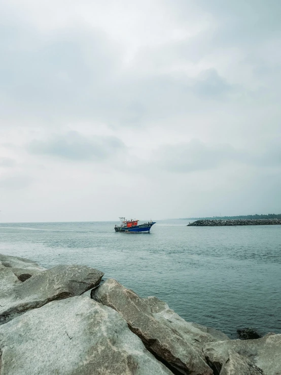 a boat sailing across a large body of water