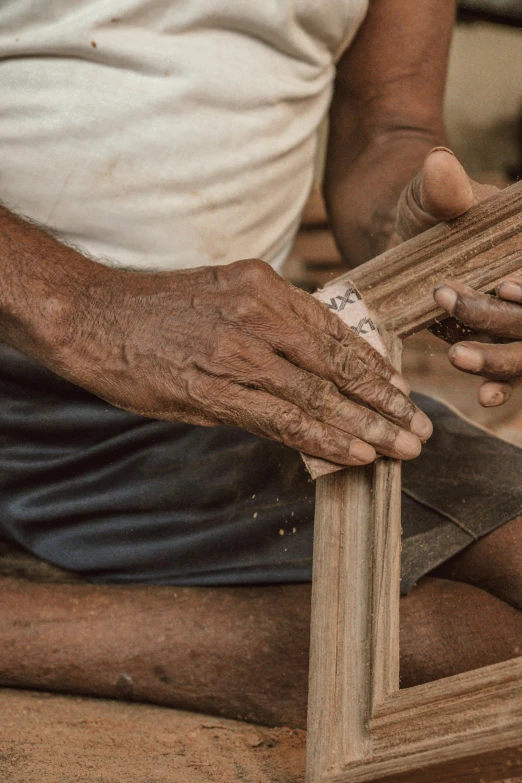 a person holding two wooden boards in their hands