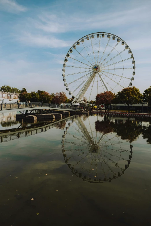 a large wheel sitting in the middle of the water