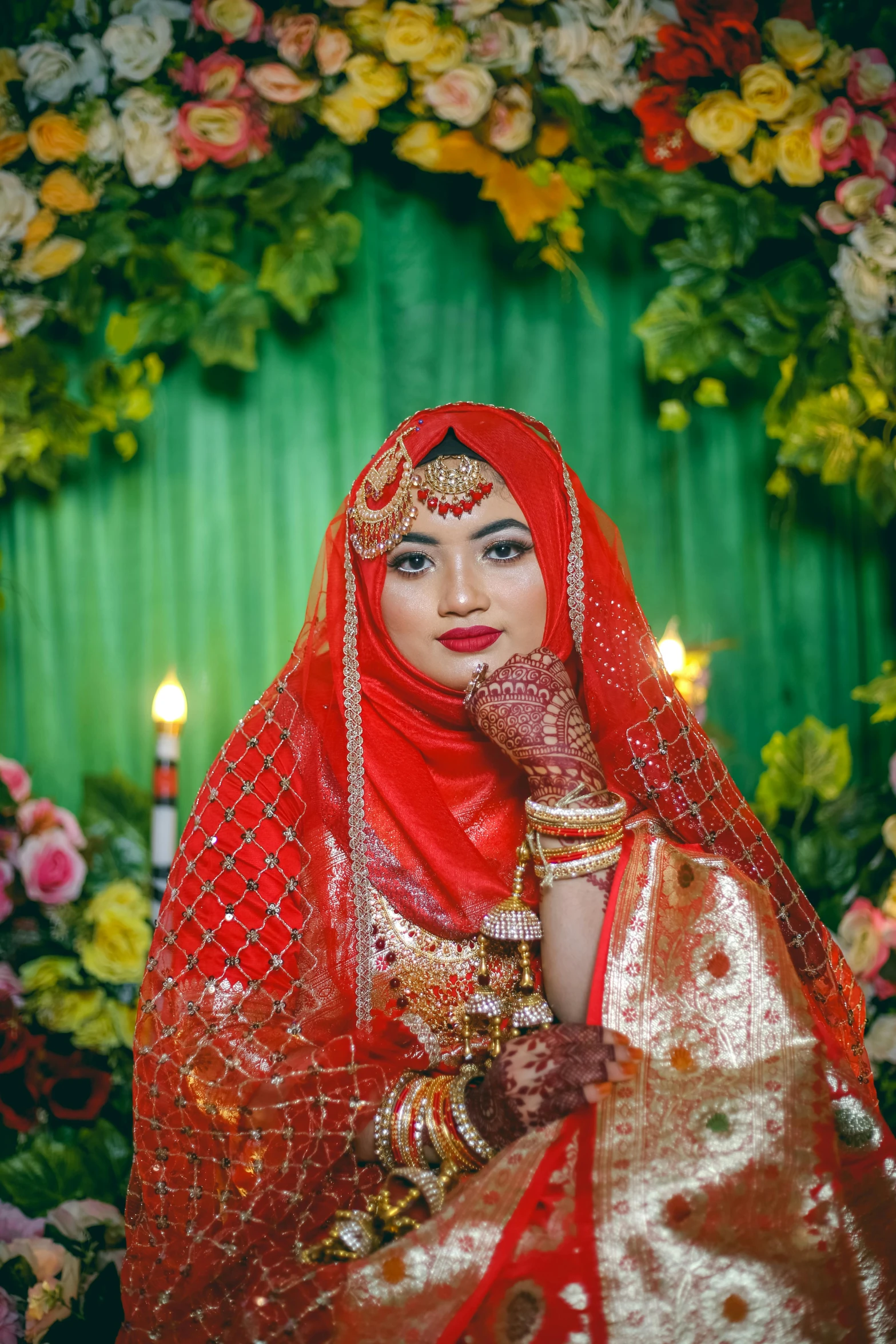 an attractive woman with a red veil and bridal