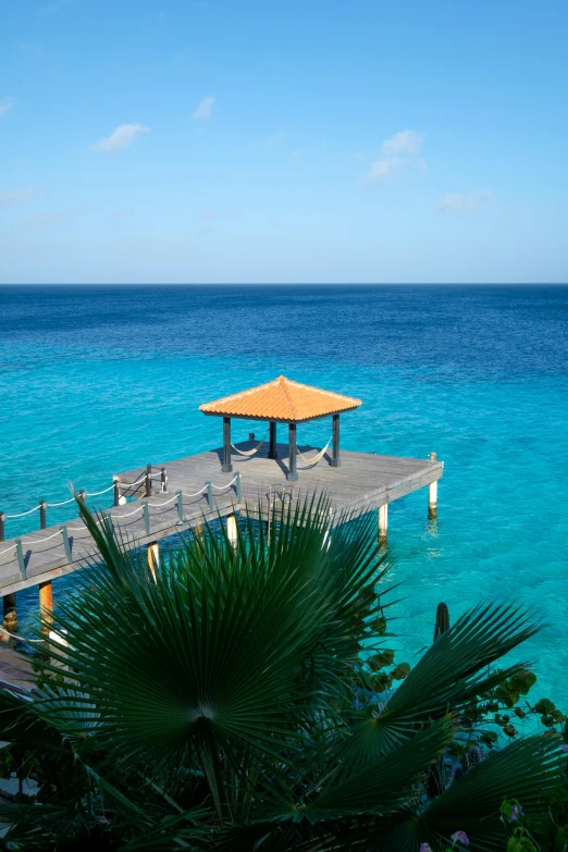 a dock and walkway in front of the ocean