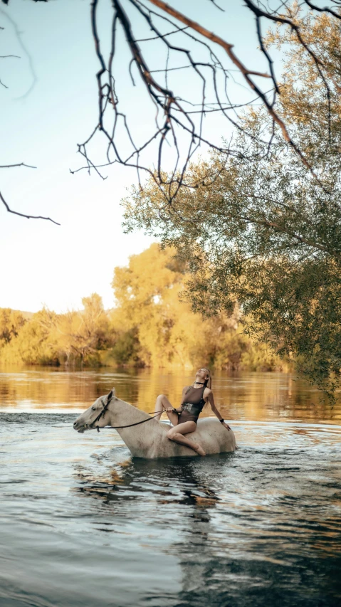 two men who are in the middle of a river