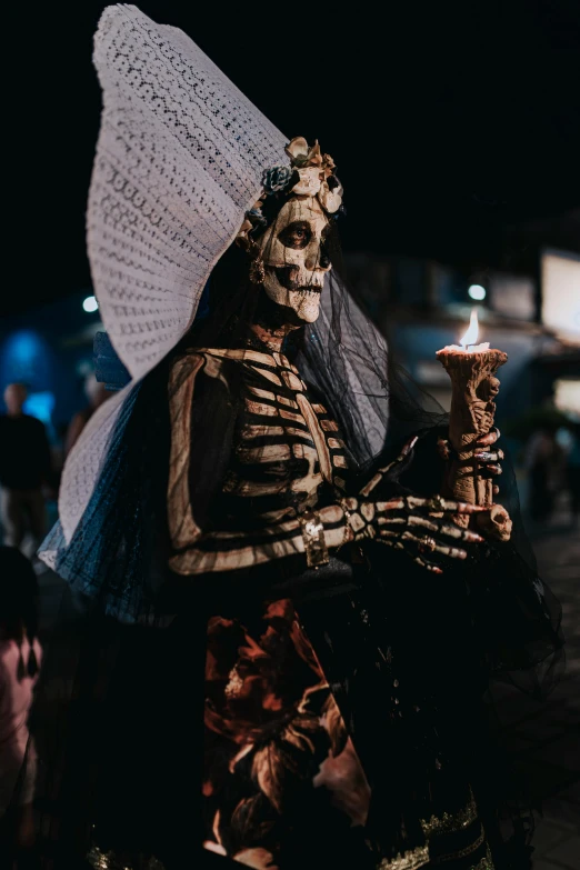 a woman with her skeleton makeup and umbrella wearing a skeleton costume