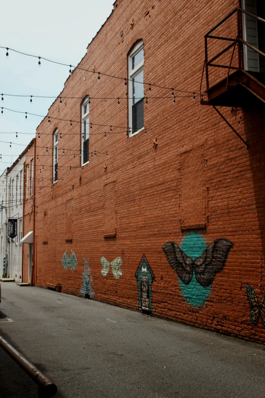 a brick wall with some writing painted on it