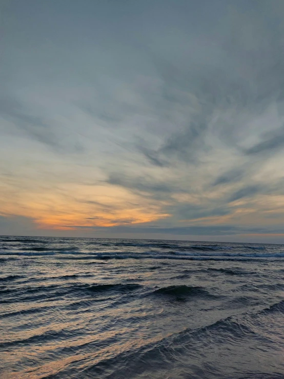 a long walk on the shore of a beach at sunset