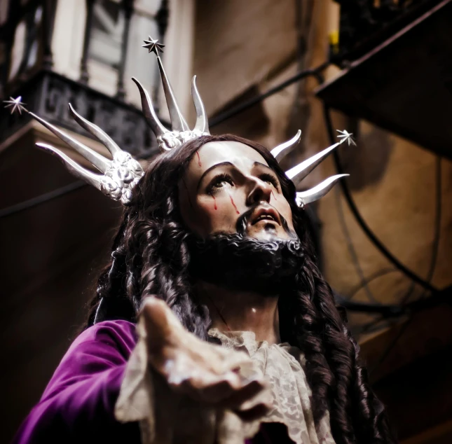 jesus statue with silver crown of spears and hair