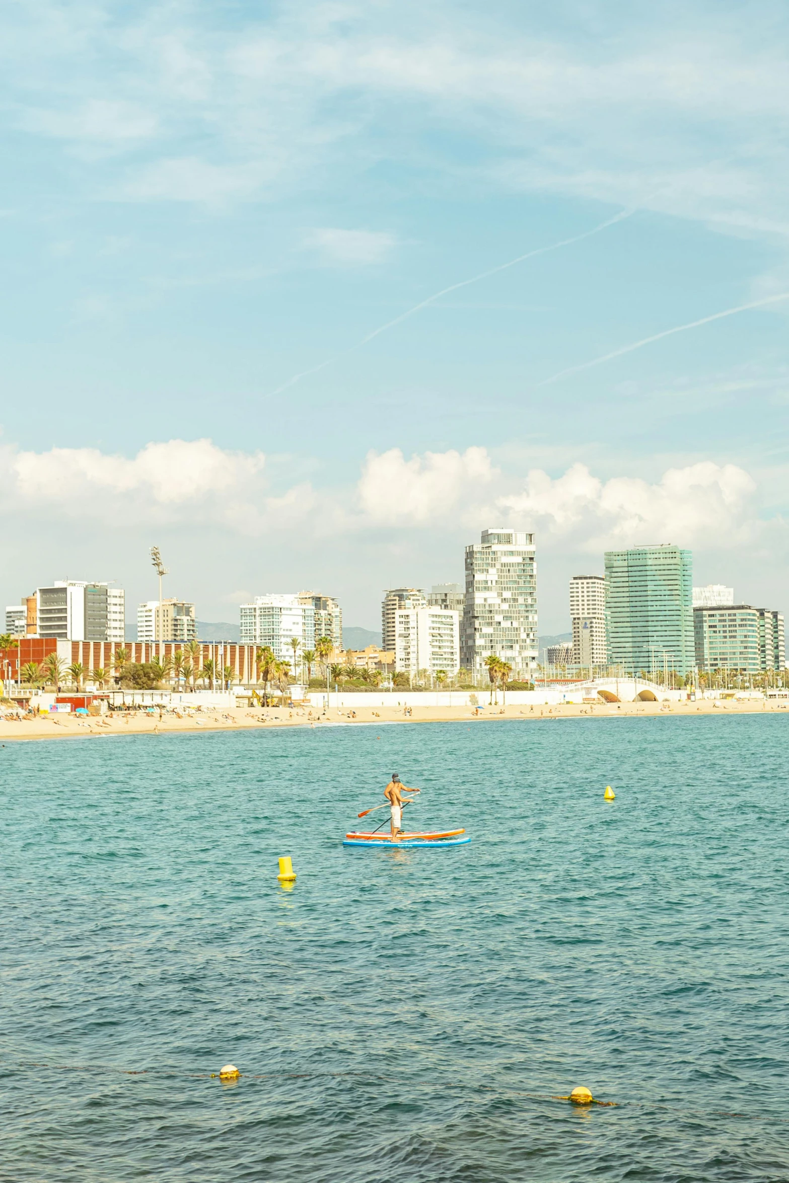 a person on a surfboard in the middle of some water