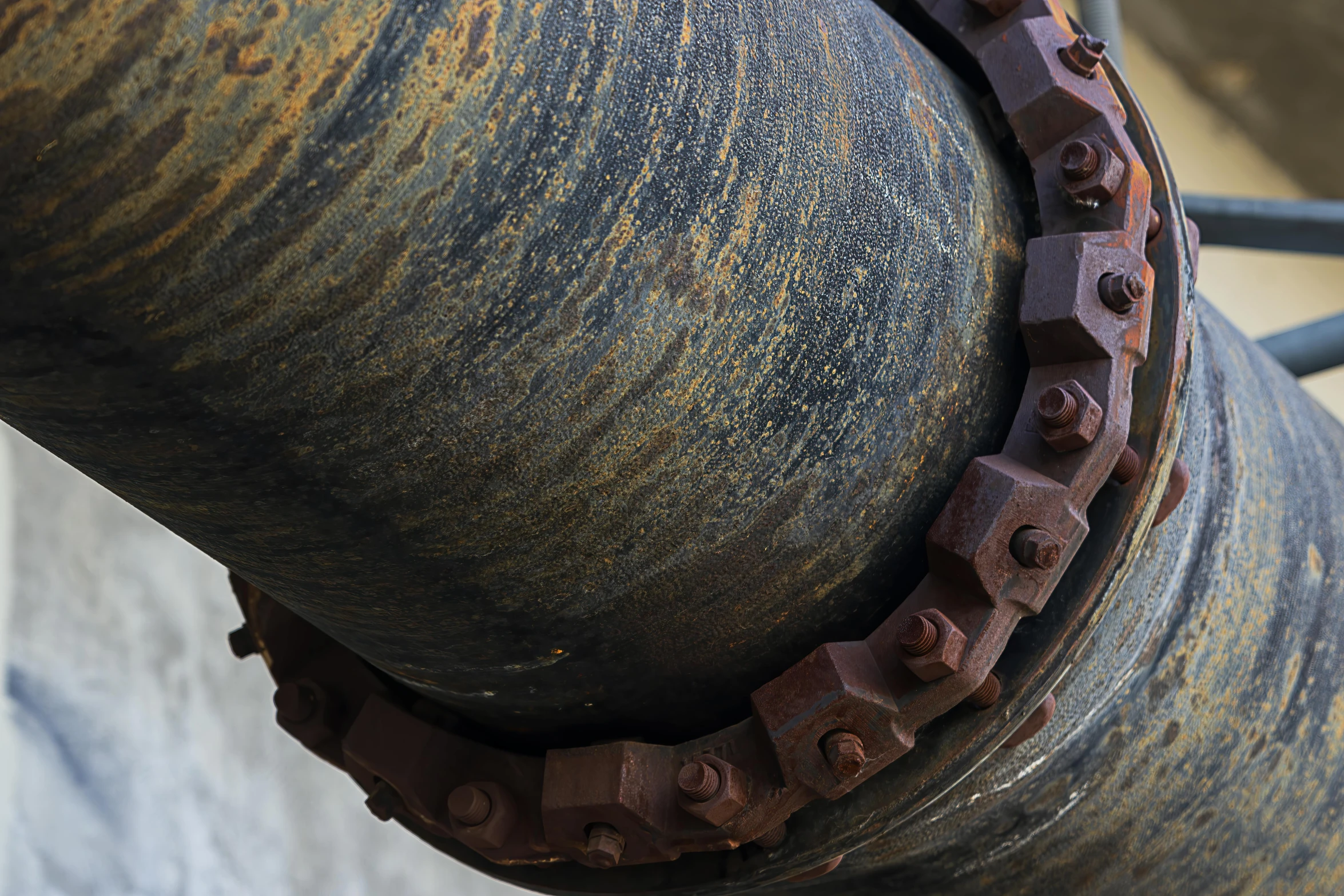 an old rusted metal fence on the side of a building