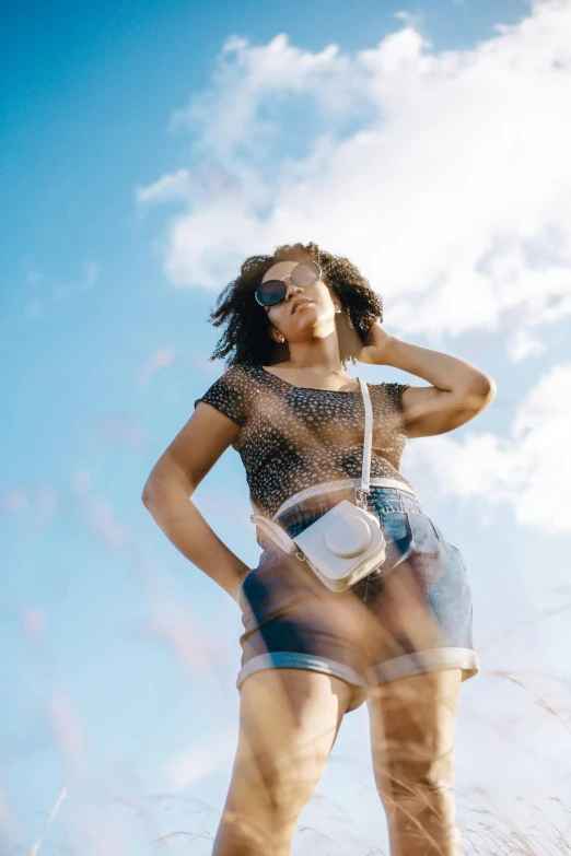 a women who is holding a camera standing up