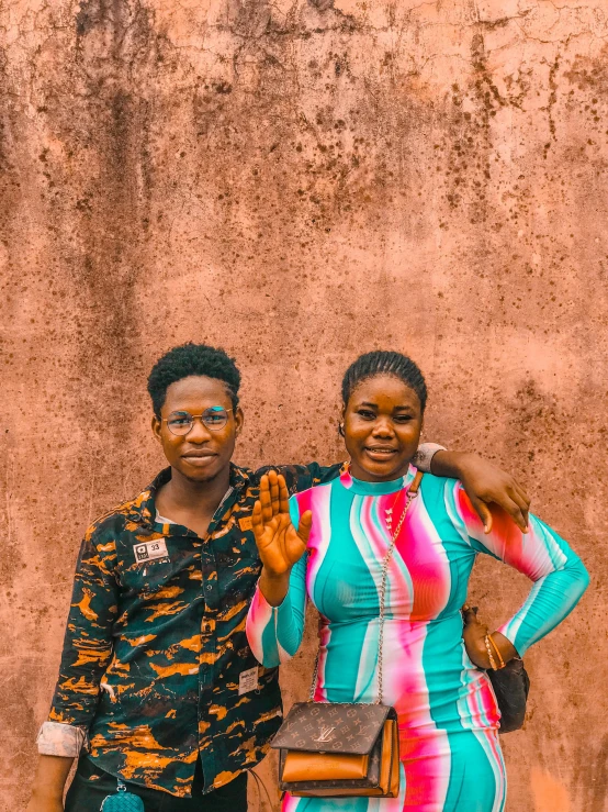 two young african american ladies wearing bright colored clothing